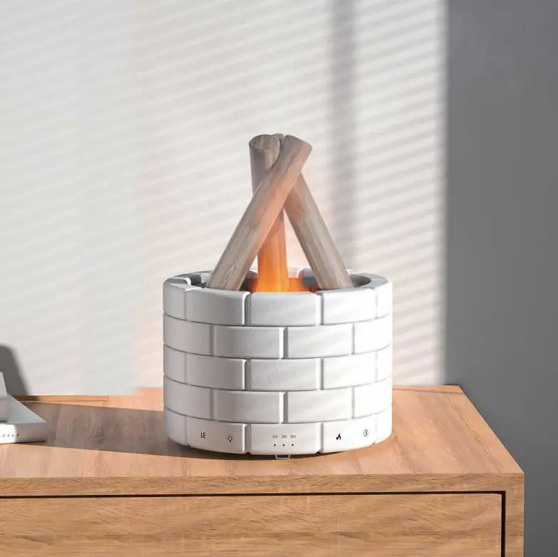 Green-Life plastic ultrasonic diffuser GFEAH9E28 with flame lighting effect, simulating realistic flame visuals while diffusing essential oils for modern decorative fragrance collections.