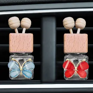 Green-Life glass bottle car air freshener GF25DS142 with silicone ornament vent diffuser design, combining decorative elements with clip-based automotive fragrance diffusion.